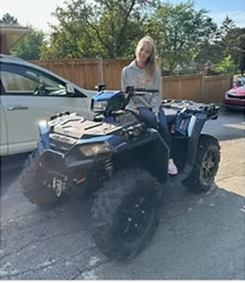 Sarah with their ATV