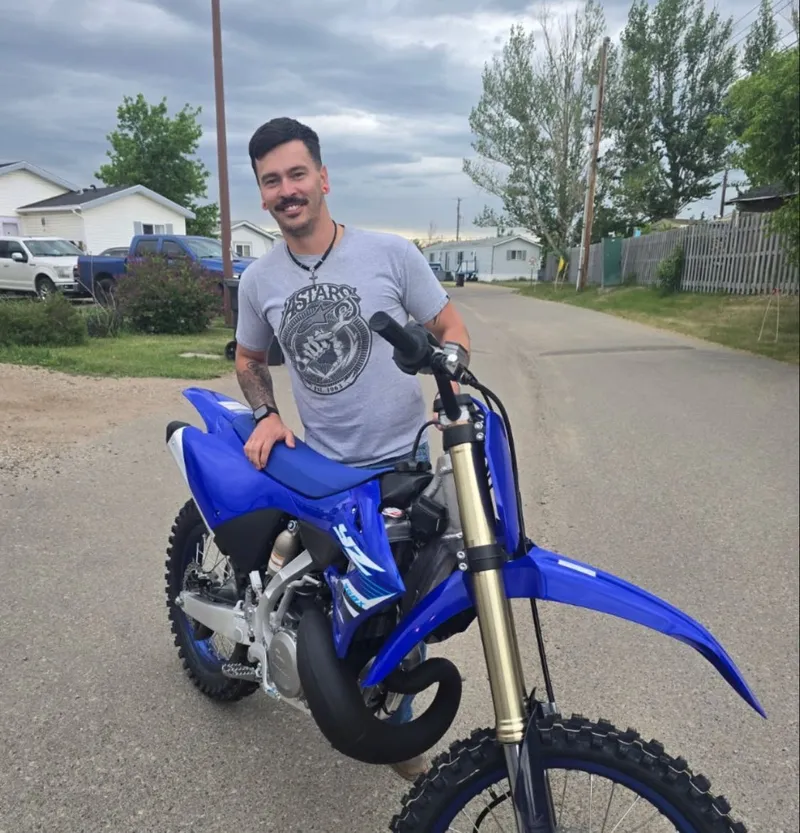 Sarah with their Dirt Bike