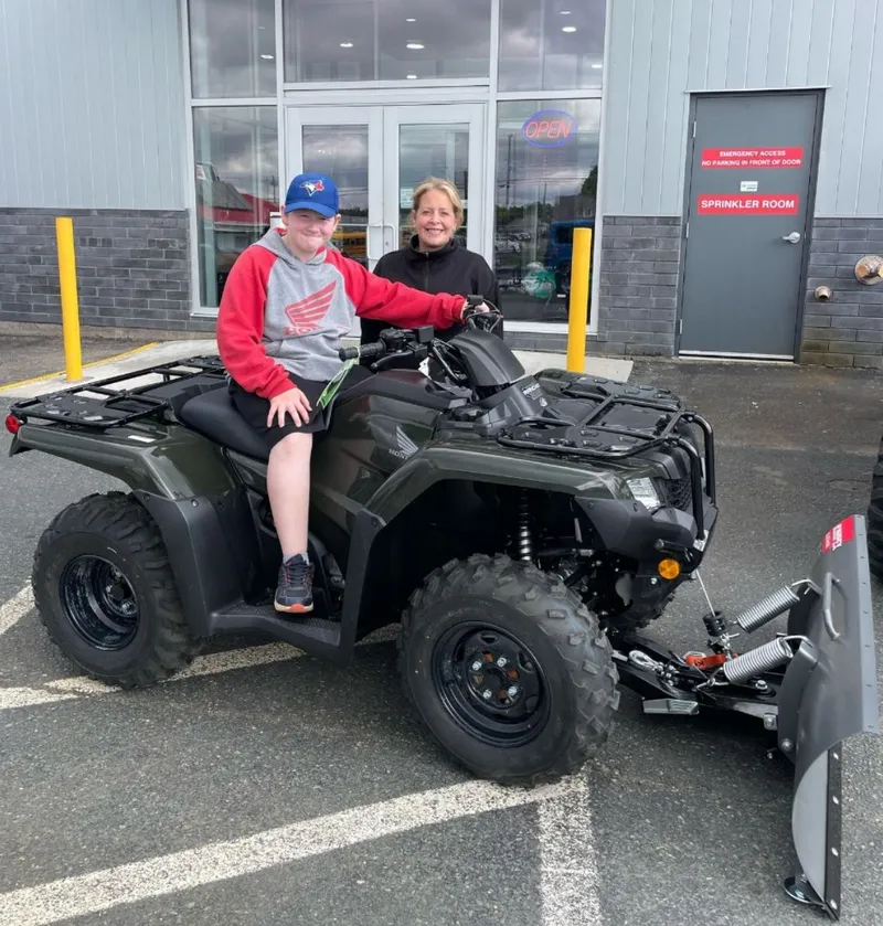 Tyler with their ATV