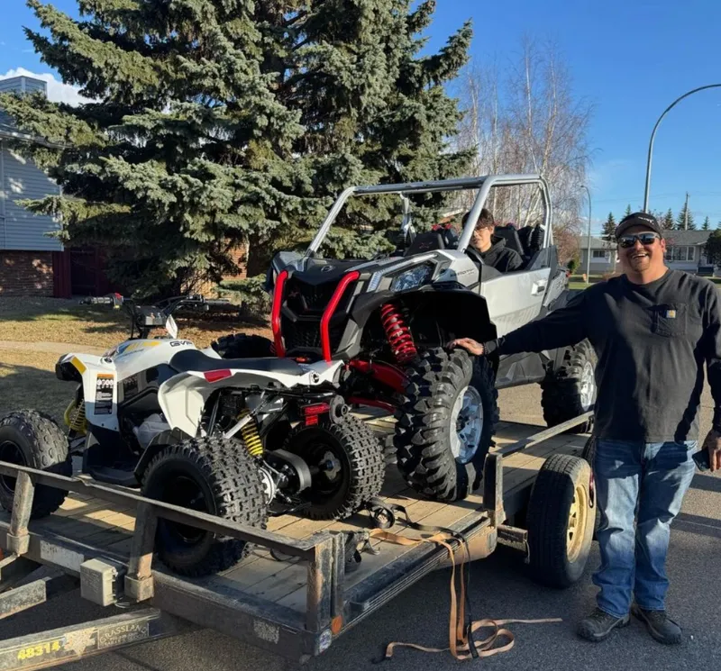 Orrin with their Side-by-Side & ATV